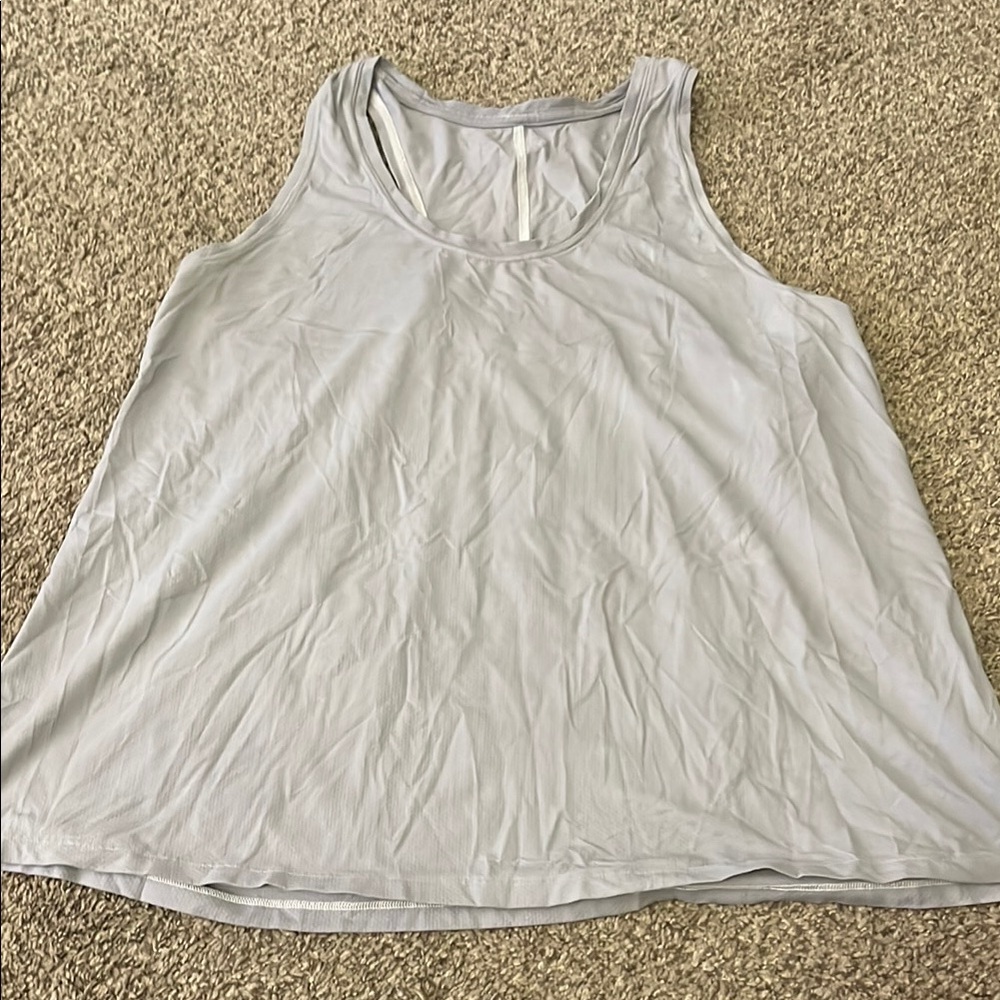 Lulu top pit to pit is 18 neck to bottom of shirt 18